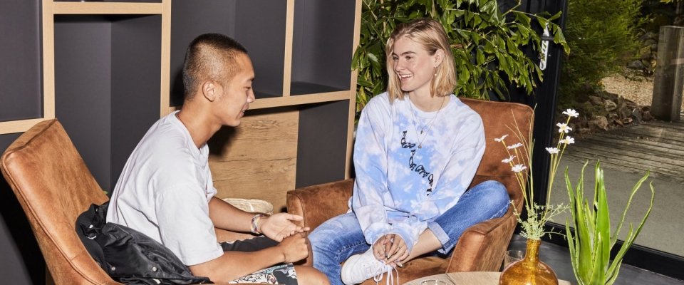 Two people sitting together